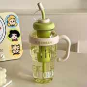 A clear plastic bottle with a green lid, straw, and handle, featuring 