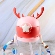 Close-up of the pink lid of a water bottle, featuring deer antlers and a white star accent.