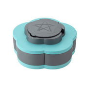 An open teal and gray petal-shaped box displays five compartments with various nuts and dried fruit, plus toothpicks in the