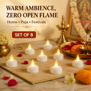 Eight lit LED tealight candles arranged on a golden mat, surrounded by flower petals and religious items.