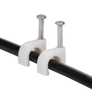 Two white plastic cable clips with nails securing a black cable against a white background.