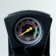 A close-up of the black foot pump's pressure gauge, showing readings in BAR and PSI.