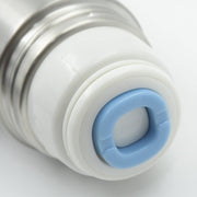A close-up of the silver flask's white and blue cap, showing the blue ring with 