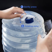 Hands demonstrate how to rotate and press the blue spigot on a translucent collapsible water container to dispense water