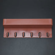 Angled view of the multi-use Key Holder Stand displaying its sleek design and ample space for organization.
