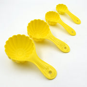 Four plastic ladoo moulds of varying sizes, showcasing their versatility for different sweets.