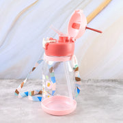 A pink and clear water bottle with its lid open, revealing a straw, on a marbled surface.