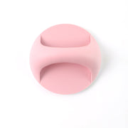 A pink self-adhesive handle is centered on a plain white background.
