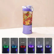 A purple portable blender with fruit, and six bottom sections demonstrating different colored LED lights.