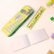 A yellow dinosaur-themed pencil case with multiplication tables and alphabet on the back, a ruler, and an open blank