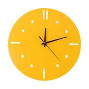 A vibrant yellow round wall clock with minimalist hour markers and black hands is isolated on a white background.