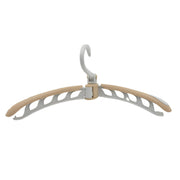 A beige and white folding hanger with a swivel hook on a plain white background.