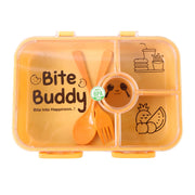 Closed yellow 4-compartment lunch box with clear lid, orange cutlery inside, and cartoon food illustrations.
