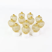 Twelve unlit gold mesh tealight covers on white bases, arranged in a grid on a plain white background.