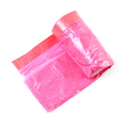 A roll of bright pink garbage bags with a red band is displayed on a white background.