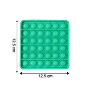 A square green silicone pop-it fidget toy with dimensions 12.5 cm by 12.5 cm indicated.