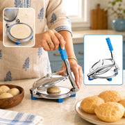 A person uses a stainless steel puri press with blue handle to flatten dough, with finished puris nearby.
