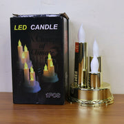 A golden triple LED flameless candle lamp next to its black packaging box, which displays