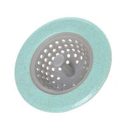 A mint green and grey silicone sink strainer basket on a white background.