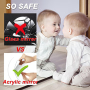 A baby sits looking at their reflection in a mirror, with insets showing glass vs. acrylic mirror safety.