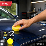 A hand applies yellow foam applicator with scratch removal wax to a blue car hood, with a 60ml label.