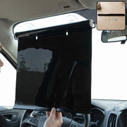Retractable car windshield sun shade in use