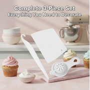 A white plastic scraper, a curved tool, and an egg separator are displayed among frosted cupcakes and a bowl of frosting.