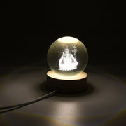A captivating 3D Crystal Ball Lamp showcasing an intricate design, illuminated with a warm glow.