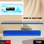 A clear rectangular acrylic box with blue liquid, a white and gray ship, and a small white dolphin inside. The product box