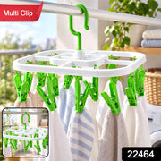 White square drying rack with green clips holding small towels, with an inset image of the rack.