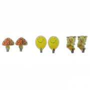 Six assorted cartoon wall hooks: two red mushrooms, two yellow smiling faces, and two sheep on skateboards, against a white