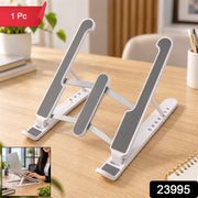 White and gray laptop stand on a wooden desk, with a small inset showing a woman using it.