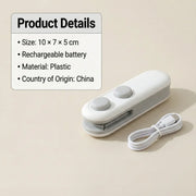 The white and grey bag sealer and cutter with its white USB-C charging cable on a light beige background.