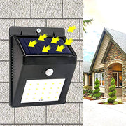 AutoSafeo black solar security LED light mounted on an outdoor wall.