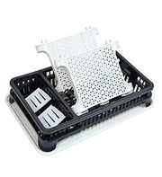 Disassembled parts of a black and white two-tier dish drying rack, showing the patterned side panels.