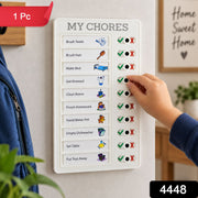 A white chore board with a child's hand marking a task, with a red 