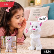 A young girl in a pink shirt smiles at a white cat toy with pink ears and nose, saying 