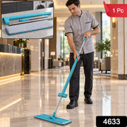 A man in a grey uniform mops a shiny tiled floor in a hotel lobby with a blue and silver mop, with a red 