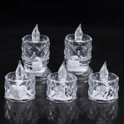 Five clear acrylic flameless LED tealight candles with clear plastic flames on a black reflective surface.