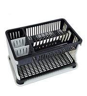 A black and white two-tier dish drying rack with a utensil holder, angled view.