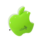 Close-up view of the green apple-shaped LED night light with a small