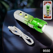 A green and silver torchlight with a white USB cable on a dark surface, with the product in its clear plastic packaging in