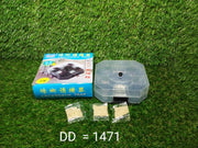 Blue box for a cockroach trap, a clear trap, and three bait packets on a green artificial grass background.