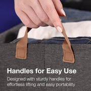 A hand holding the brown fabric handle of a gray storage basket filled with clothes, with text overlay.