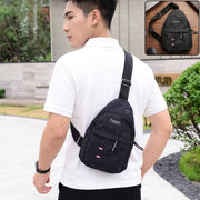 A man wearing a black sling bag across his chest, with a smaller inset image of the bag.
