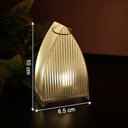 A single transparent arch stripe LED candle with measurements of 10 cm height and 6.5 cm width, glowing on a dark surface.