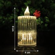 A single clear ribbed LED flameless candle with warm glow, measuring 8 cm tall and 4 cm wide.