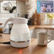 A white collapsible electric kettle with steam rising, next to a mug of tea in a kitchen setting. Insets show the kettle and