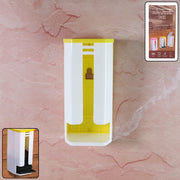 A white and yellow plastic bag dispenser is mounted on a pinkish-brown textured wall
