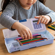 A child's hands placing colorful pencils into a light blue Avengers pencil box with an integrated calculator.